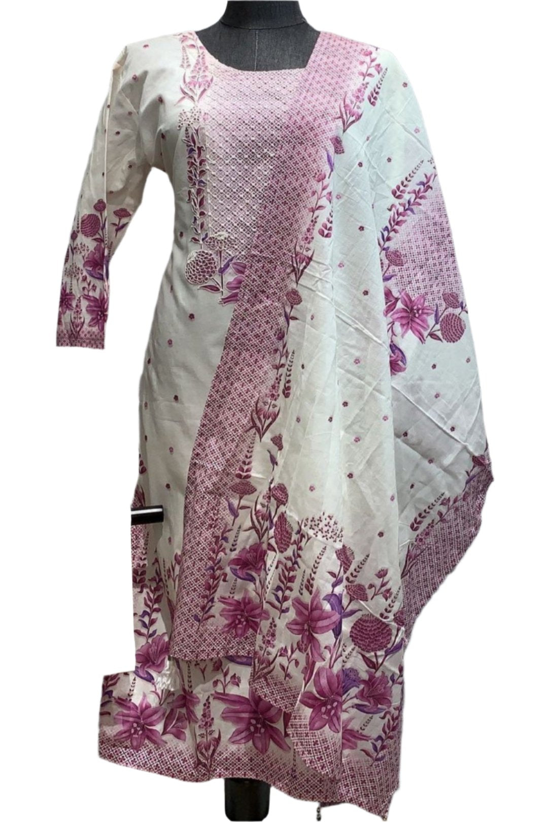 Kurtha with long sleeves which includes a panel of pink fabric with a smaller scale print that matches the larger purple flowers. The neckline has round neck .