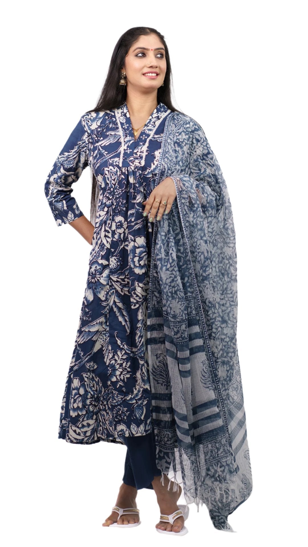 Salwar kameez with a dupatta long, flowing garment The garment features intricate patterns that include floral and foliage motifs.