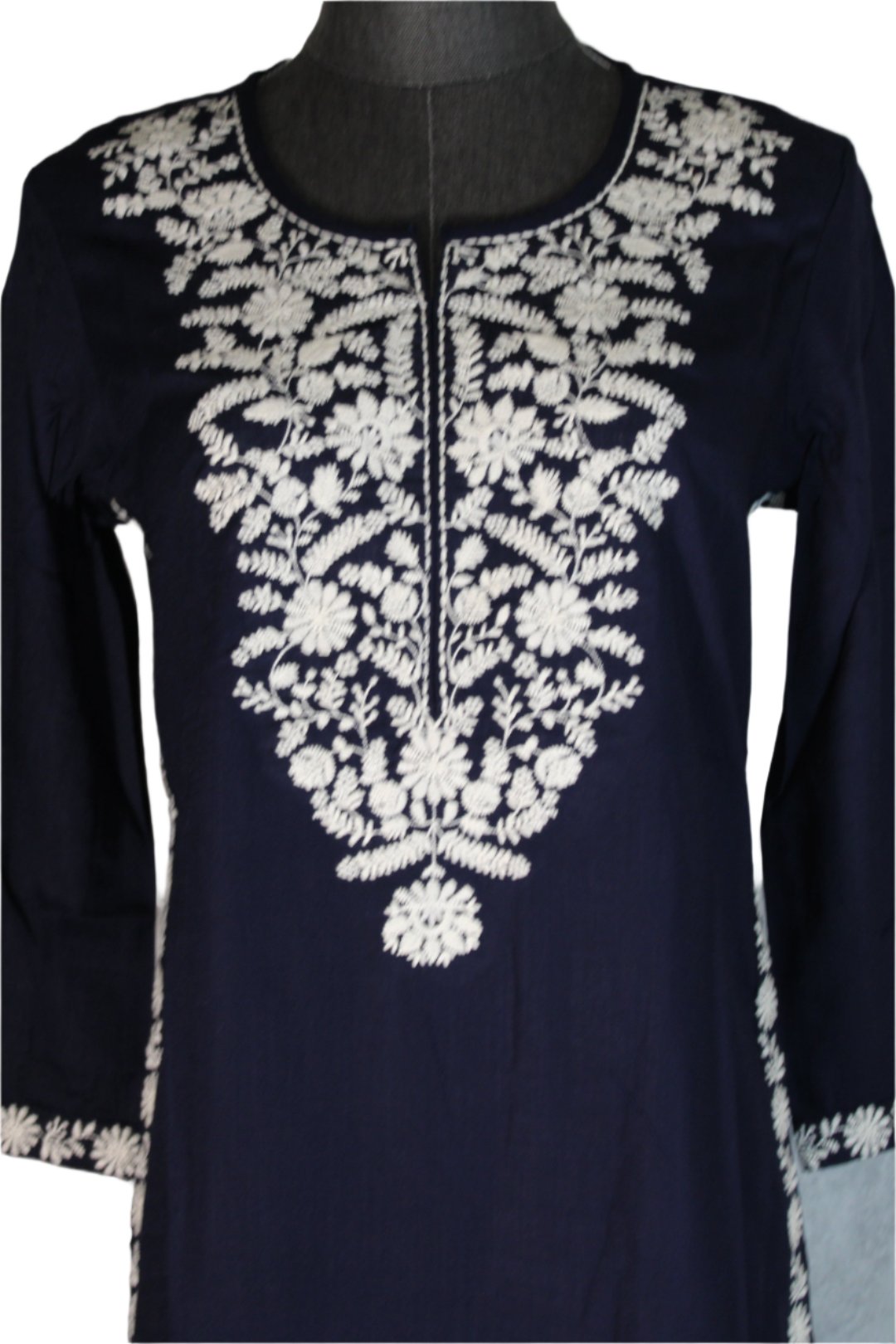 Chikankari single kurti for   women which has handmade embroidery along the neckline, chest area, and sleeve edges.