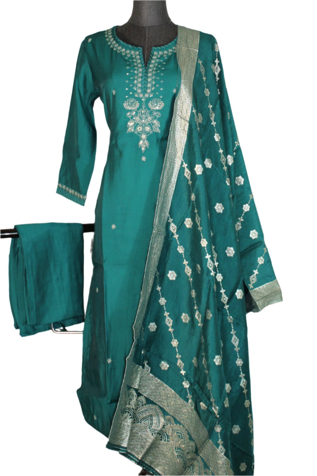 Kurtha with full sleeves and a round neckline. The tunic features intricate embellishments around the neckline and down the center, with white and embroidery or beadwork.