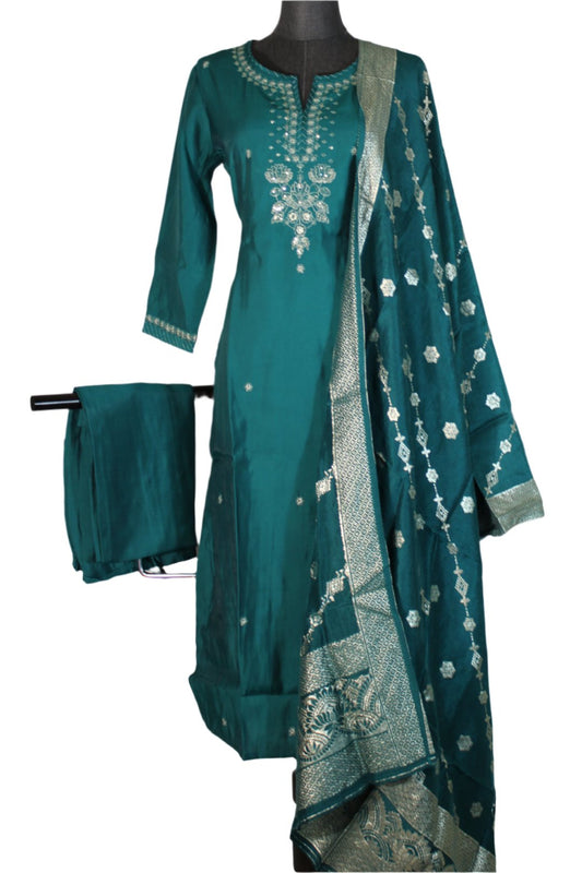 Kurtha with full sleeves and a round neckline. The tunic features intricate embellishments around the neckline and down the center, with white and embroidery or beadwork.