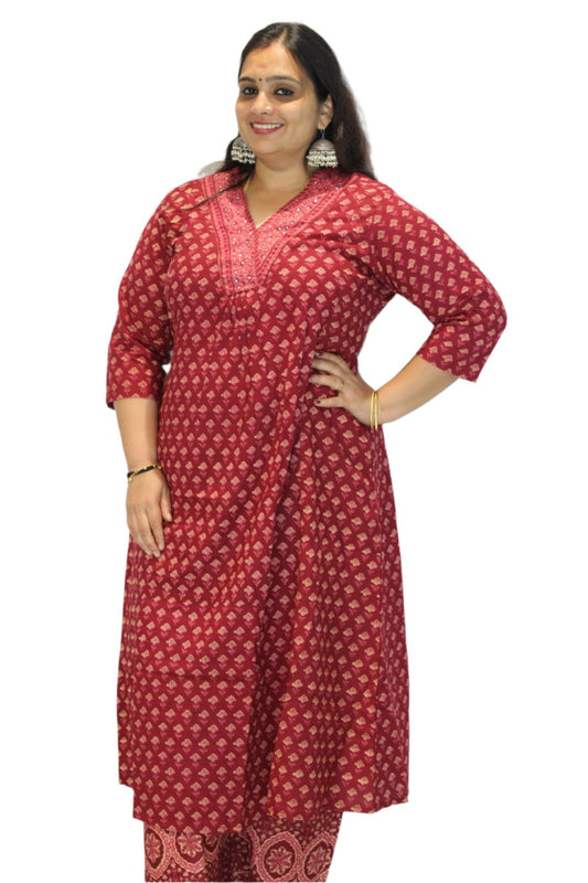 Cotton salwar kameez along with the dupatta is a long-sleeved garment featuring intricate gold patterns throughout. The design includes floral and geometric motifs